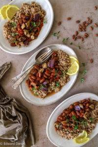 Soft pinkish-brown vegan Rose Coco Bean Aubergine Stew with smoked paprika, ginger and garlic, with a touch of citrus lemon. Edward Daniel ©.