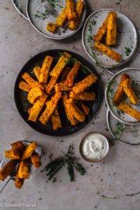 Crispy tart vegan gluten-free Sumac Thyme Polenta Chips recipe; with piquant garlic seasoned with salt and pepper and air fried to perfection. Edward Daniel ©.