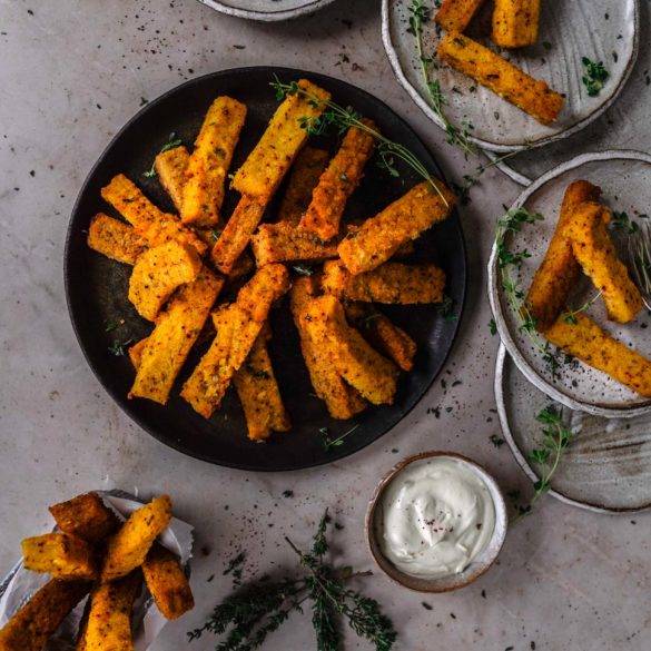 Crispy tart vegan gluten-free Sumac Thyme Polenta Chips recipe; with piquant garlic seasoned with salt and pepper and air fried to perfection. Edward Daniel ©.