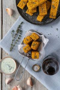 Crispy tart Sumac and citrus Thyme Polenta Chips with piquant garlic seasoned with salt and pepper and air fried to perfection.