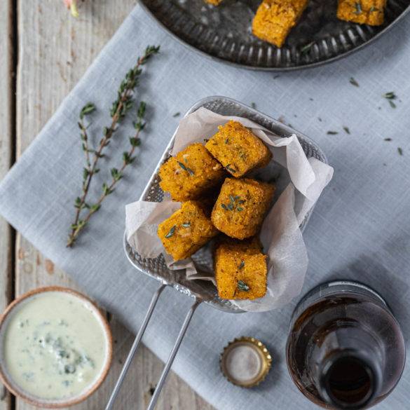 Sumac and Thyme Polenta Chips Flatlay Crispy tart Sumac and citrus Thyme Polenta Chips with piquant garlic seasoned with salt and pepper and air fried to perfection.