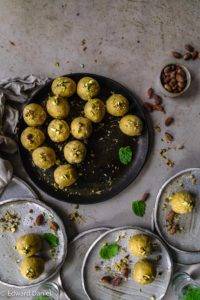 Vegan gluten-free Besan Ladoos recipe; ladoos flavoured with sweet citrus cardamoms, nutty pistachios, aromatic coconut and roasted chick pea. Edward Daniel ©.