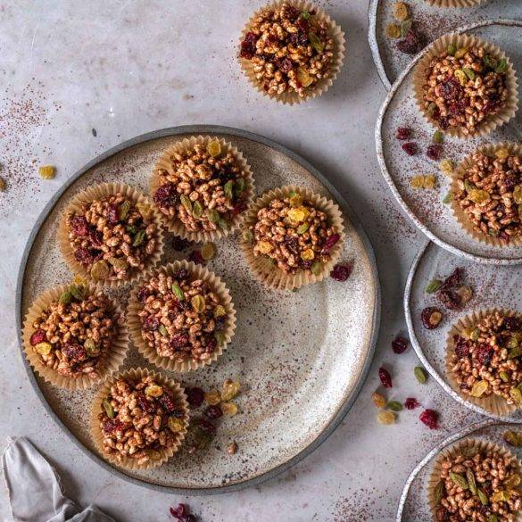 Puffed rice coated in dark chocolate, golden syrup with dried mixed cranberries, raisins, sultanas and cherries; Vegan gluten-free Chocolate Puffed Rice Cakes. Edward Daniel ©.