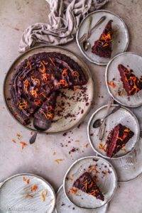 Rich moist velvety vegan gluten-free Chocolate and Marmalade Cake recipe; with orange zest and lemon in polenta, almond and quinoa pastry topped with chocolate ganache. Edward Daniel ©.