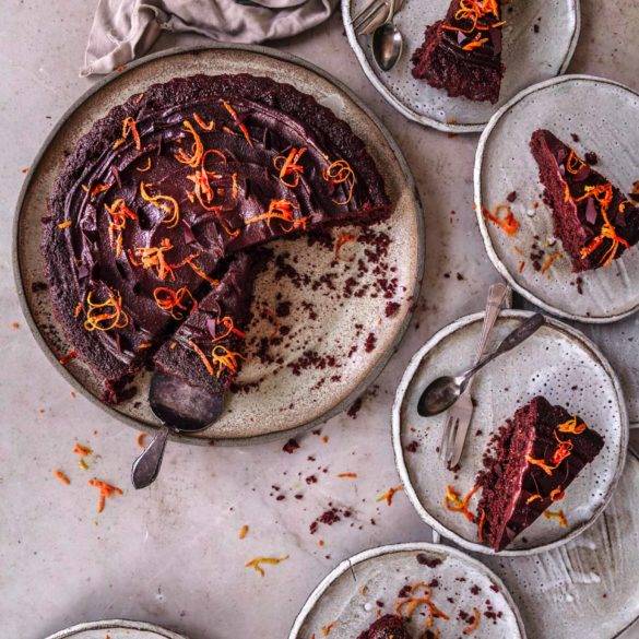 Rich moist velvety vegan gluten-free Chocolate and Marmalade Cake recipe; with orange zest and lemon in polenta, almond and quinoa pastry topped with chocolate ganache. Edward Daniel ©.