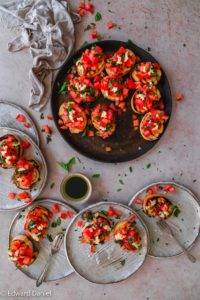 Lashings of diced tomatoes topped with basil and garlic, drizzled with olive oil and balsamic vinegar on griddled bread; vegan Tomato Bruschetta; Italian cuisine. Edward Daniel ©.