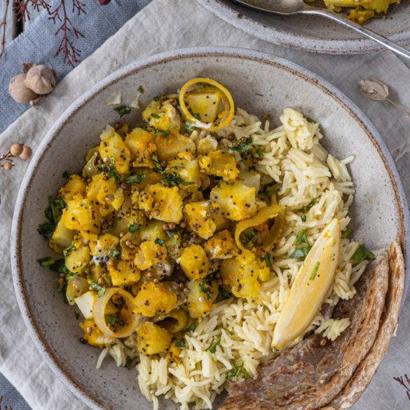 Fluffy pillowy Bombay Potatoes parboiled and sauteed with bitter mustard seeds, lemony coriander seeds and musky turmeric.