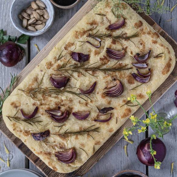 Aromatic mint-pine-like Rosemary scented and fleshy Red Onion scattered over an Italian olive oil pillowy Focaccia bread.