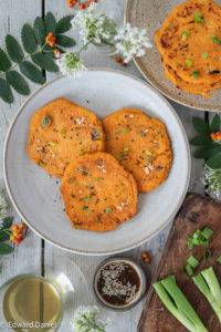 Piquant chilli-flavoured Kimchi Pancakes with seasonal chopped sweet spring onions served with a rice vinegar toasted sesame dipping sauce.