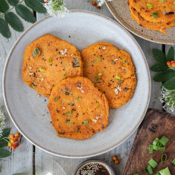 Piquant chilli-flavoured Kimchi Pancakes with seasonal chopped sweet spring onions served with a rice vinegar toasted sesame dipping sauce.