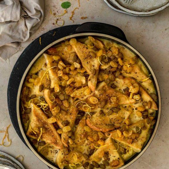 Crisp buttered bread drenched in a creamy coconut almond saffron custard with cinnamon and nutmeg; vegan Bread and Butter Pudding recipe. Edward Daniel ©.