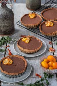Citrusy kumquat eliciting floral chocolate embedded in a nutty hemp cream laid over a peppery amaranth pastry; Kumquat and Chocolate Tart.