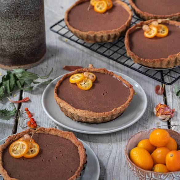 Citrusy kumquat eliciting floral chocolate embedded in a nutty hemp cream laid over a peppery amaranth pastry; Kumquat and Chocolate Tart.