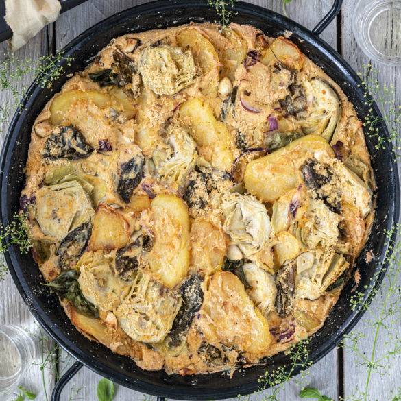 Creamy earthy Artichoke bathed in slivers of potatoes with peppery-anise-like basil wafting encrusted in a pillowy tofu Frittata.