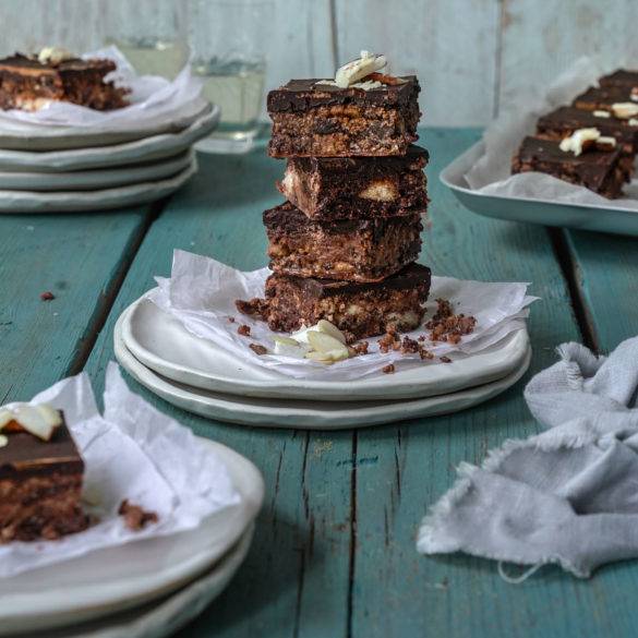 Bite-sized firm almond rice-based biscuit with coconut raisin, topped will a layer of dark chocolate; Coconut Chocolate Tiffin. Edward Daniel ©.