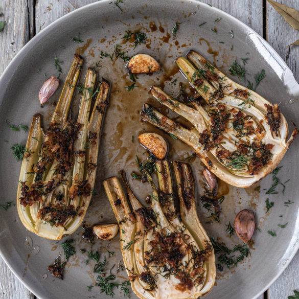 Anise-like fennel roasted with a garlic and ginger lime sauce garnished with liquorice-like dill; Roasted Fennel with Dill and Ginger.