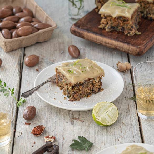 Zucchini Cake with hints of woody mace, cinnamon and cardamon and a drizzle of lime juice plumped with sundried raisins and buttery pecans.