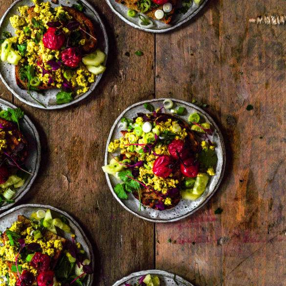 Earthy ginger-like turmeric Tofu Scramble with bulbous piercing spring onions and roasted succulent tart tomatoes. Edward Daniel ©.