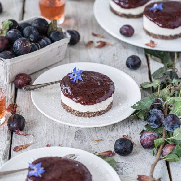 Freshly picked tart ripe damsons over a creamy cacao sesame filling on a mulberry pecan biscuit; Damson Cheesecake.