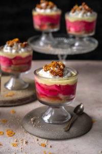 Grenadine poached rhubarb, madeira-soaked sponge, zesty orange, saffron ginger custard, cream topped with caramelised nuts; vegan gluten-free Rhubarb Trifle recipe, British cuisine. Edward Daniel ©.