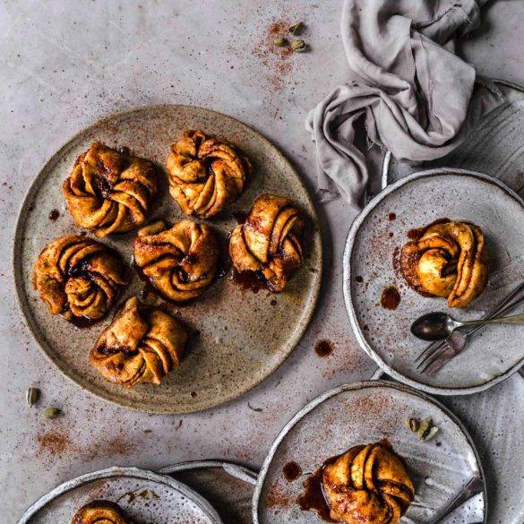 Twirled sorghum rice leavened pastry with fragrant smoky cardamon, earthy cinnamon and caramelised coconut; Vegan gluten-free Cinnamon Buns recipe. Edward Daniel ©.