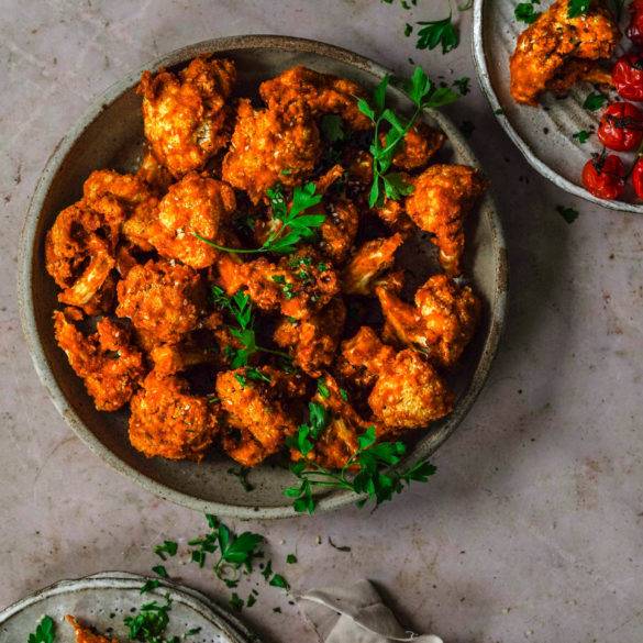 Cauliflower rubbed in rose sweet paprika, kicking cayenne pepper, minty oregano, sun-kissed sundried tomatoes and nutty sesame seeds slowly dehydrated to intensify flavours; vegan gluten-free Raw Cauliflower Buffalo Wings; paleo too. Edward Daniel ©.