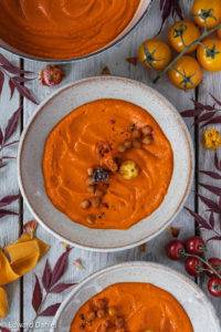 Creamy charred Roasted Pepper and Tomato Soup flavoured with oregano and harissa thickened with lentil pearls.