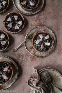 Apples, raisins, sultanas, currents infused with cinnamon, mixed spice, mace and nutmeg fermented in brandy on a teff millet pastry; vegan gluten-free Traditional Mince Pies recipe. Edward Daniel ©.