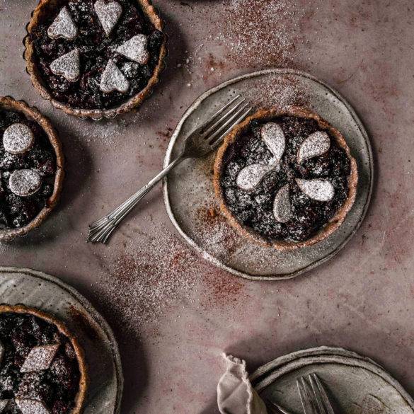 Apples, raisins, sultanas, currents infused with cinnamon, mixed spice, mace and nutmeg fermented in brandy on a teff millet pastry; vegan gluten-free Traditional Mince Pies recipe. Edward Daniel ©.