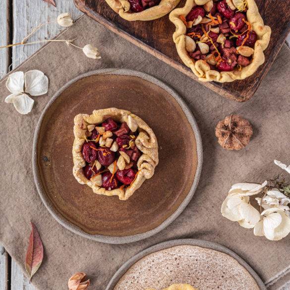 Citrus Cranberry Mince Pies made with lemon and orange peel, cinnamon, allspice, mace and nutmeg with a chickpea tapioca pastry.