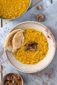 Pressured creamy velvety turmeric chana dal topped with a curry leave, mustard and cumin seed tadka; Tadka Dal.