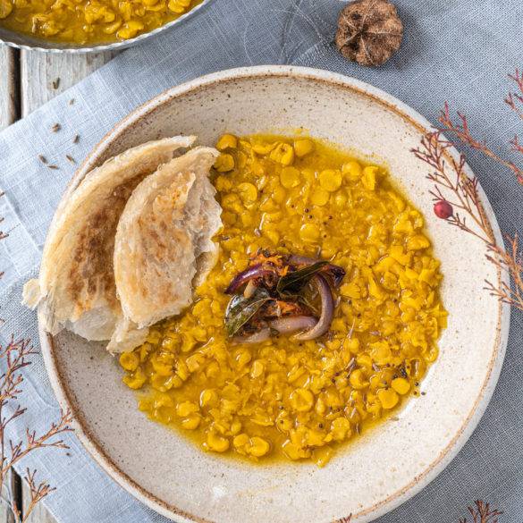 Pressured creamy velvety turmeric chana dal topped with a curry leave, mustard and cumin seed tadka; Tadka Dal.