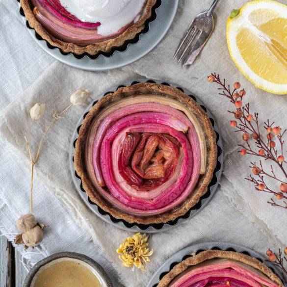 Juicy rich puckery tangy sour Rhubarb Tart laced with citrus sugar in an amaranth oat flaxseed shortcrust pastry.