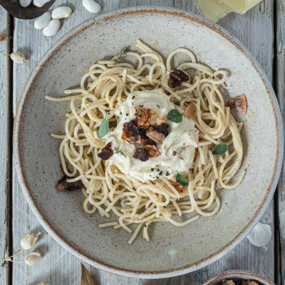 Vegan Carbonara made with creamy butter beans and delicate cauliflower florets with marinaded mushroom pancetta and coconut bacon.