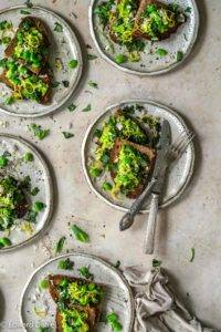 Dehusked broad beans with lemon, olive oil, shallots, garlic and clove-like basil and crushed peppercorns; vegan Crushed Broad Bean Bruschetta recipe. Edward Daniel ©.