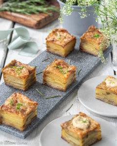 Floral woody rosemary scented crunchy compressed potatoes, slow-baked and pressed in olive oil; Potato Pave.