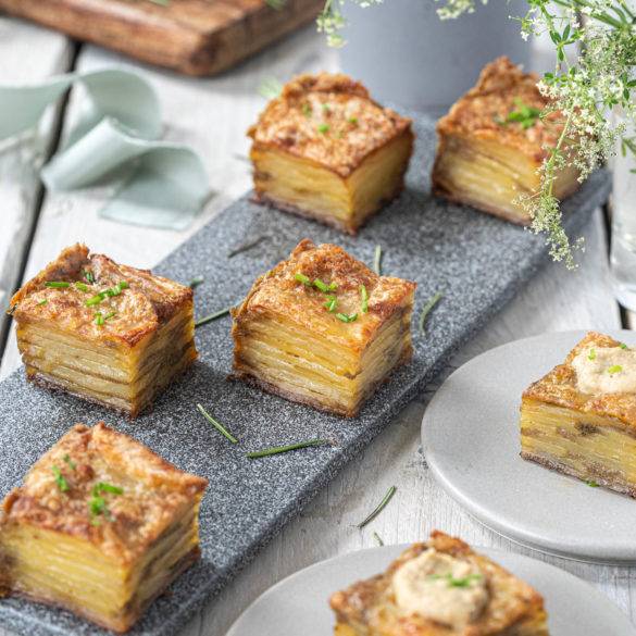 Floral woody rosemary scented crunchy compressed potatoes, slow-baked and pressed in olive oil; Potato Pave.