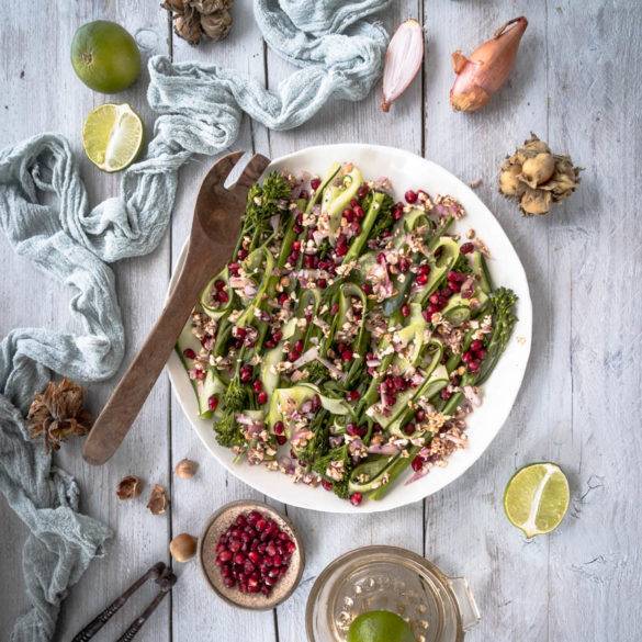 Caption of Broccoli Salad with Pomegranate and Cob Nuts Flatlay. Image by Edward Daniel