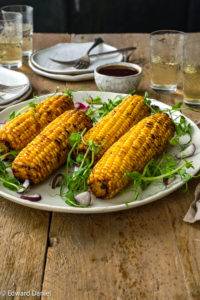 Grilled sweet corn kernels marinated in pomegranate molasses with citcusy sumac, sweet paprika and lime juice; Grilled Marinated Corn. Edward Daniel ©.
