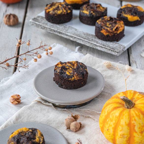 Fudgy nutty Pumpkin Brownies enriched with pumpkin flesh, ground almonds, coconut flakes and cacao powder.