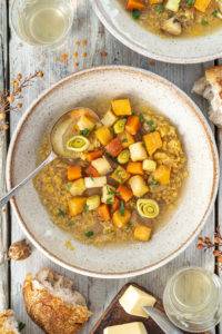 Earthy root swede, carrots, celery and leeks slowly simmered with lentils to produce a sweet soup; Vegan Welsh Cawl.