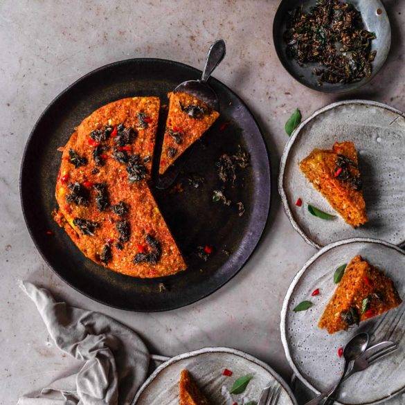 Savoury sponge vegan gluten-free Dhokla cake recipe; with ginger, turmeric, chili, lemon topped with mustard, cumin, asafoetida and curry tadka. Edward Daniel ©.