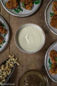 Homemade silky smooth glossy creamy Vegan Mayonnaise with nutty cashews, citrus lemon juice, olive oil and salt. Edward Daniel ©.