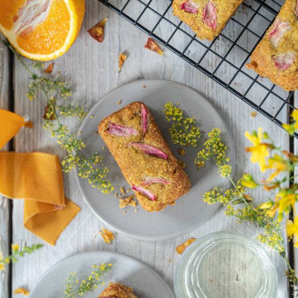 Citrusy orange nicely balanced with tangy hints of rhubarb spatially littered across this moist gluten-free Rhubarb and Orange Cake.