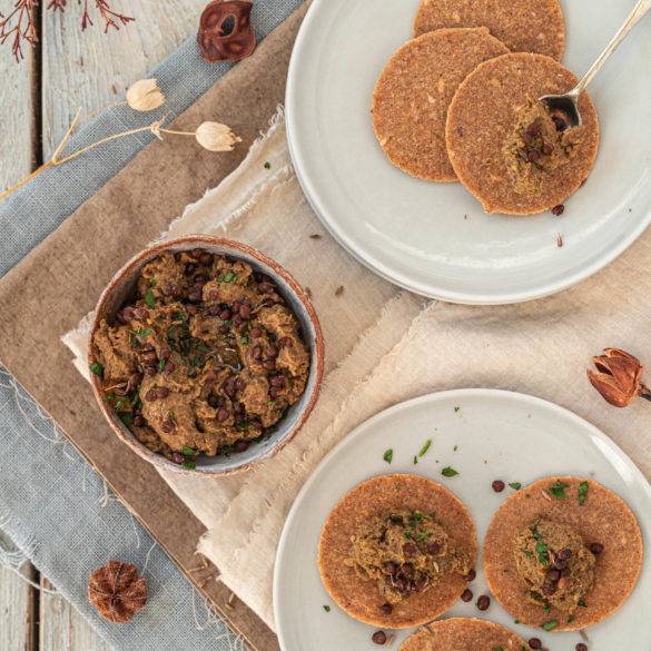 Full-bodied buttery earthy sweet Beluga bean Dip recipe, a vegan condiment; infused with cumin, lemon, jalapeno, garlic and bitter parsley. Edward Daniel ©.