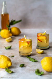 Lemonade recipe; free flowing liquid Lemonade made with citrus lemon juice and zest in a sugar syrup downed with melting ice. Edward Daniel ©.