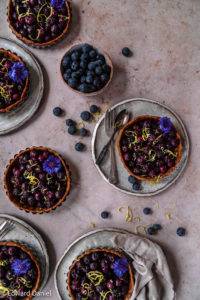 Succulent tangy burst Blueberry Pie recipe; pie infused with citrus lemon and earthy cinnamon on a millet teff pastry bed. Edward Daniel ©.