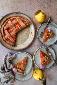 Golden pinkish floral vegan gluten-free Quince Crostada recipe, Italian cuisine; with citrus lemon in a millet teff pastry served with lashings of ice cream. Edward Daniel ©.
