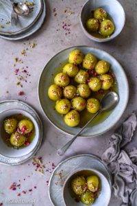 Soft moist mouth-watering vegan Gulab Jamun recipe, Indian cuisine; with semolina, coconut, citrus lemony cardamon in a rose, saffron and lemon sugar syrup. Edward Daniel ©.