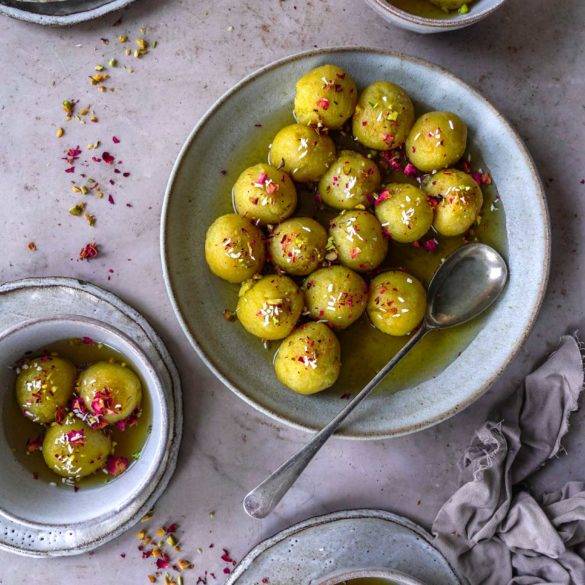 Soft moist mouth-watering vegan Gulab Jamun recipe, Indian cuisine; with semolina, coconut, citrus lemony cardamon in a rose, saffron and lemon sugar syrup. Edward Daniel ©.